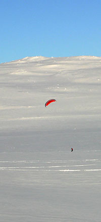 Kite-skiing near Haugastol on the Bergen to Oslo railway, over Hardangervidda